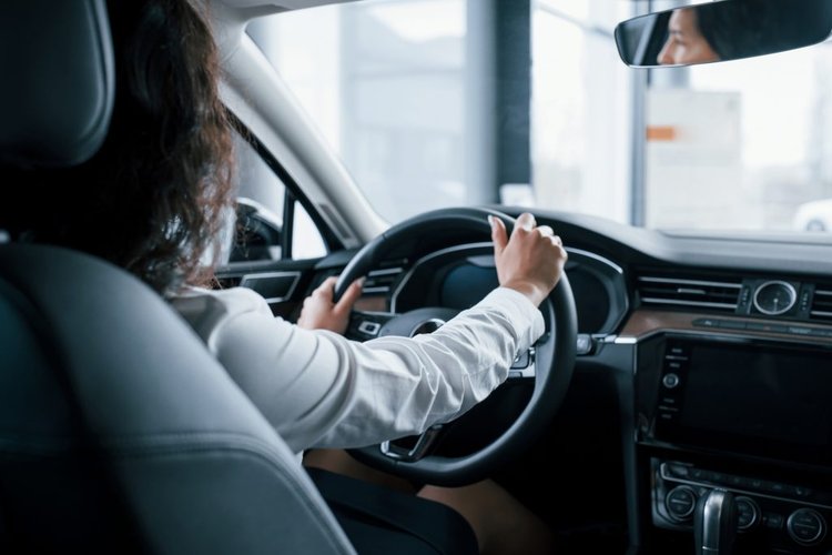 hands-steering-wheel-beautiful-businesswoman-trying-her-new-car-automobile-salon-1024x684
